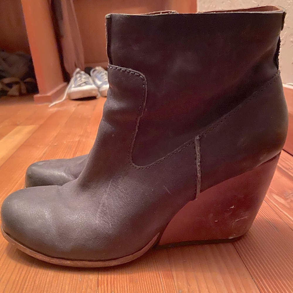 Navy designer heeled boots.